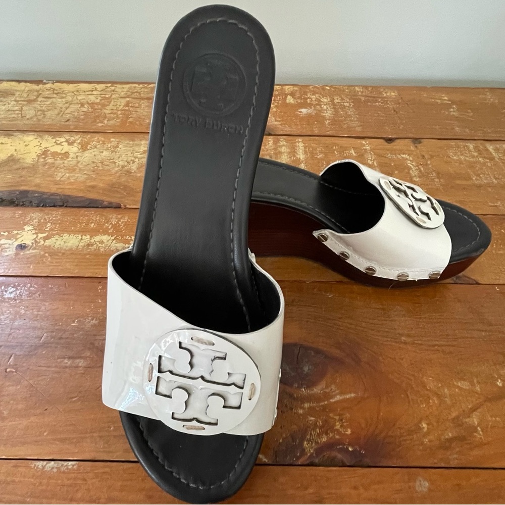 Tory Burch Selma patent leather mule clogs.